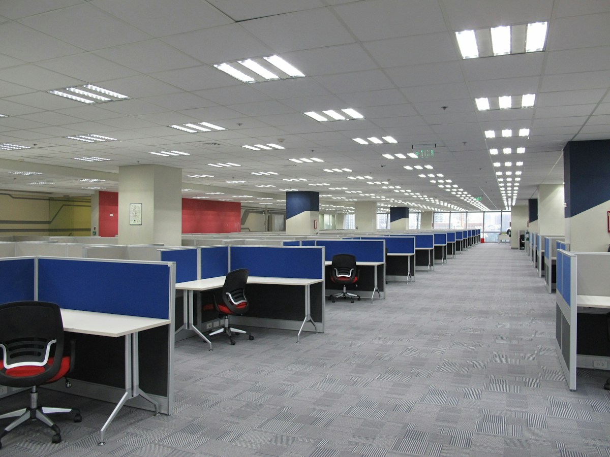 An empty office cubicle with chairs and desks in the Philippines