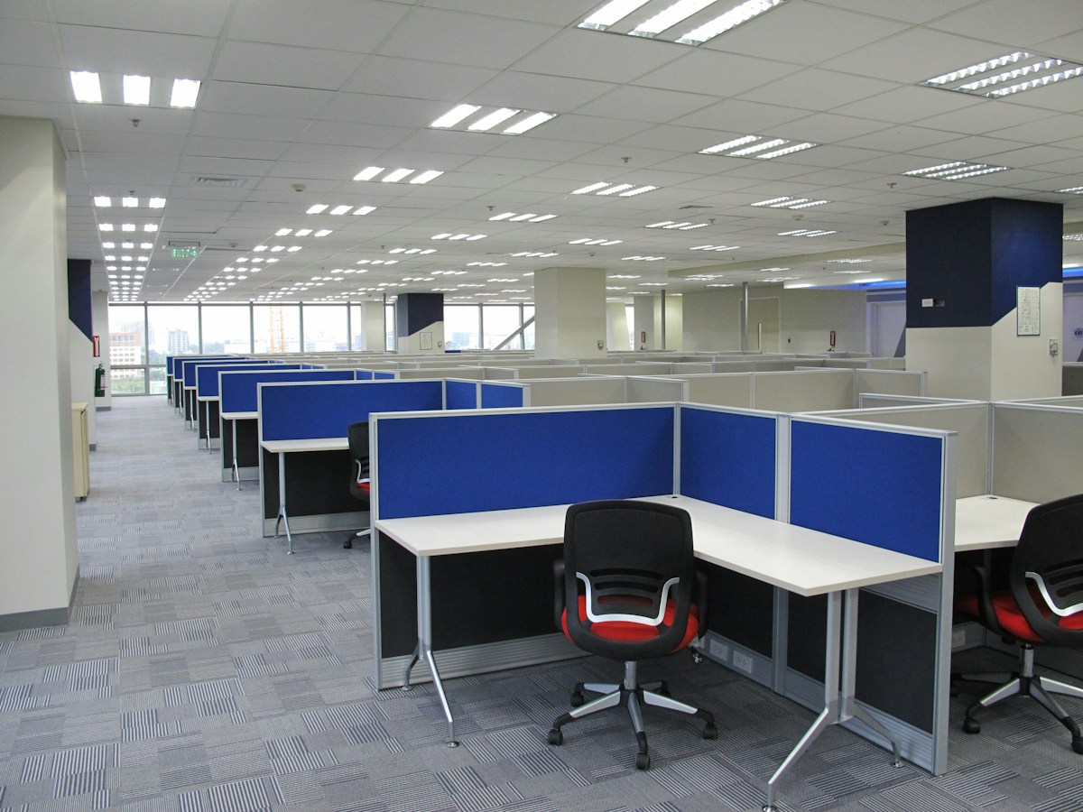 An empty office cubicle with chairs and desks in the Philippines